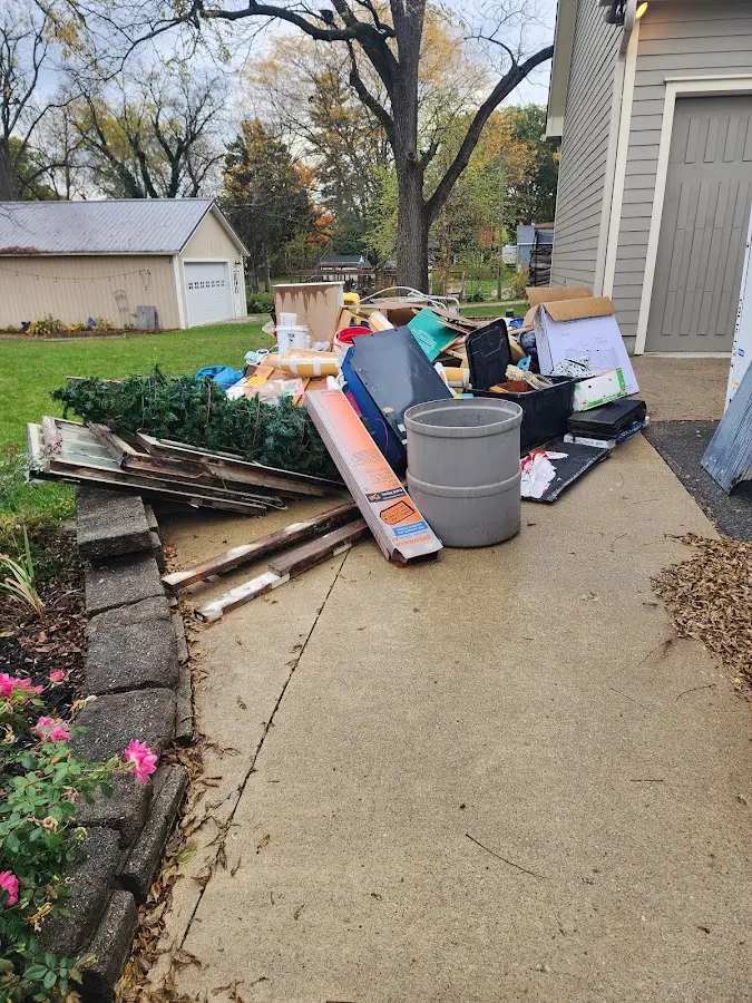 Dumpster being loaded with debris for Residential Dumpster Rental in Dighton
